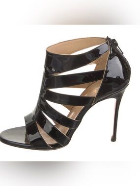 Christian Louboutin "Beauty K" Cage Sandals features sleek black patent leather